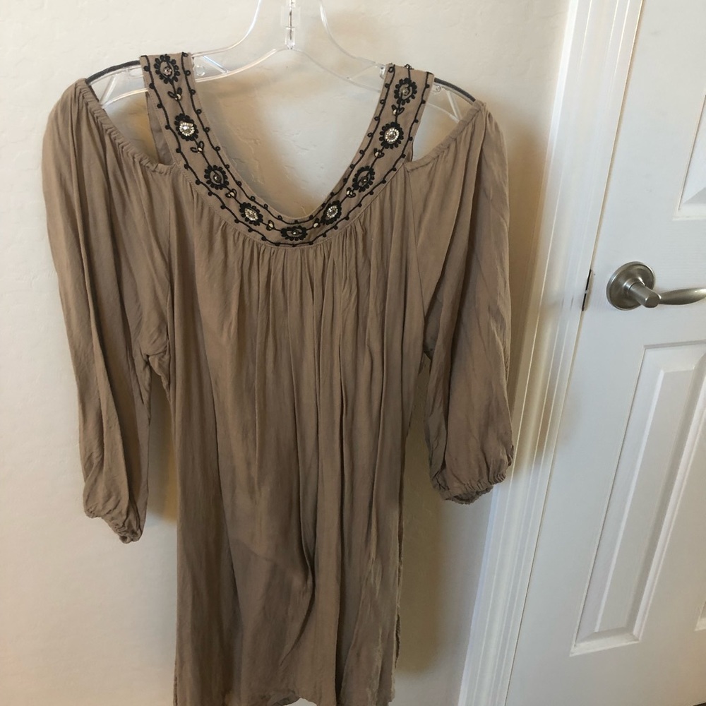 Blouse has pretty beading all over.